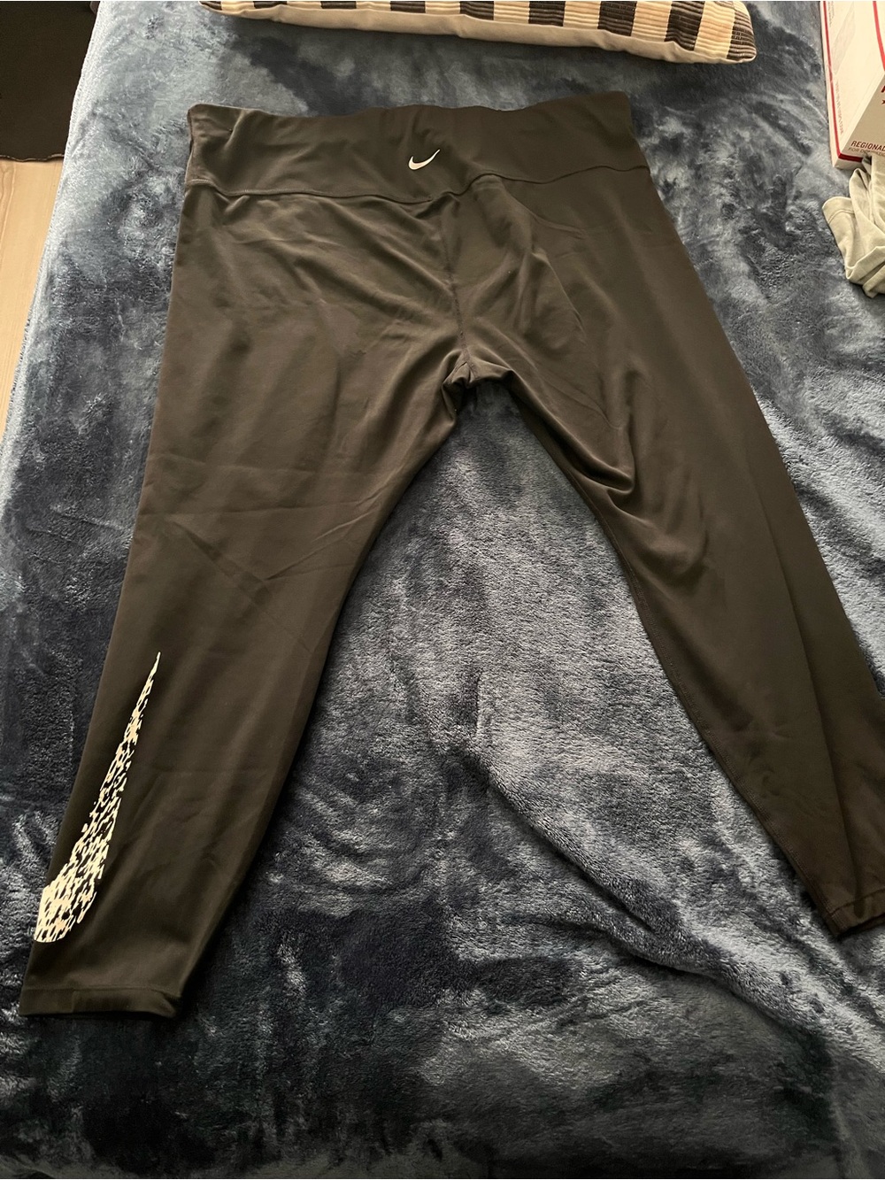 Nike Black Capri leggings with White cheetah Swoosh Detail.